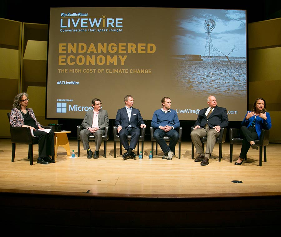 A panel of local and national experts including, from left, moderator Lynda Mapes, Joe Casola, Clinton Moloney, Spencer Reeder, Mike Gempler and Fawn Sharp, discuss climate change’s impact on the Pacific Northwest economy.