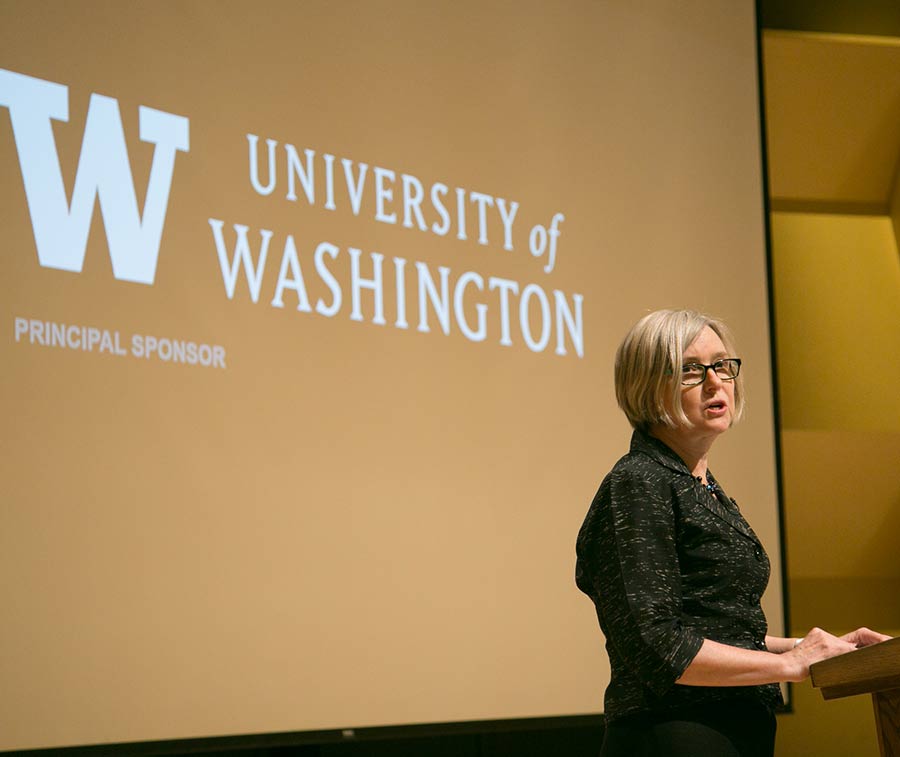Kim England, professor of geography at the University of Washington, welcomed the audience to Kane Hall.